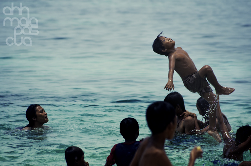 children enjoying the water on easter sunday in malapascua